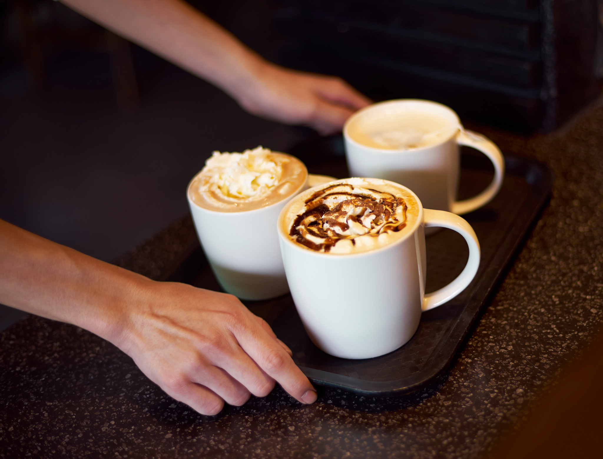 coffee shop server delivering coffee
